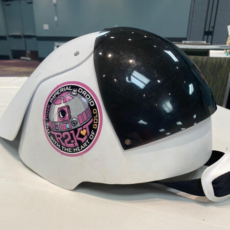 “The Gold Heart”, attached to Dylan’s Rebel Friend/Fleettrooper Helmet given by Lucasfilm’s Star Wars Costume Club at Megacon Orlando 2023, for protecting Little Leia, Vivien Lyra Blair